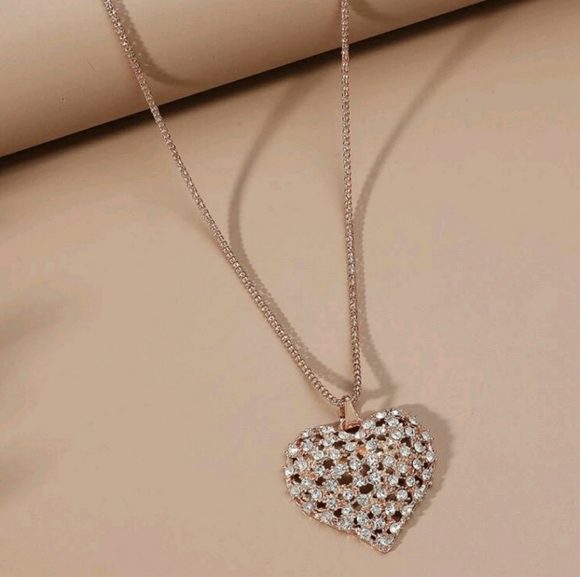 Unk Jewelry - Rose Gold long chain with blinged out heart pendent